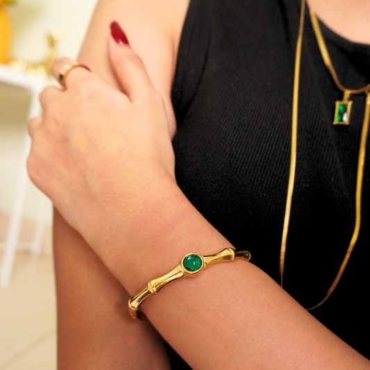 18K gold-plated bracelet and pendant set with emerald-green stones from Ashara Jewels