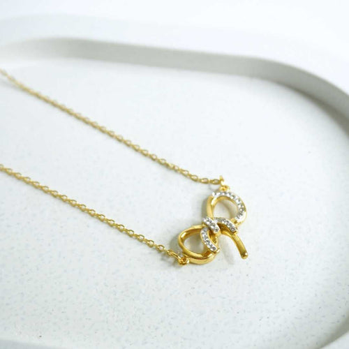 Golden Crystal Bow Necklace – 18K gold-plated pendant necklace