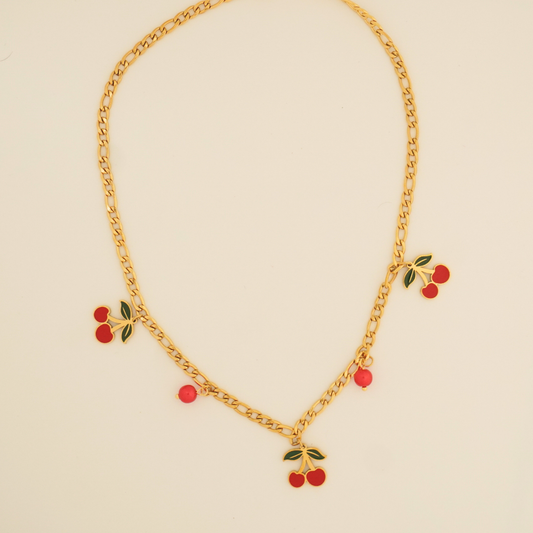 Ashara Jewels Cherry Blush Necklace – a playful gold chain necklace with red cherry enamel charms from the Flora Collection.