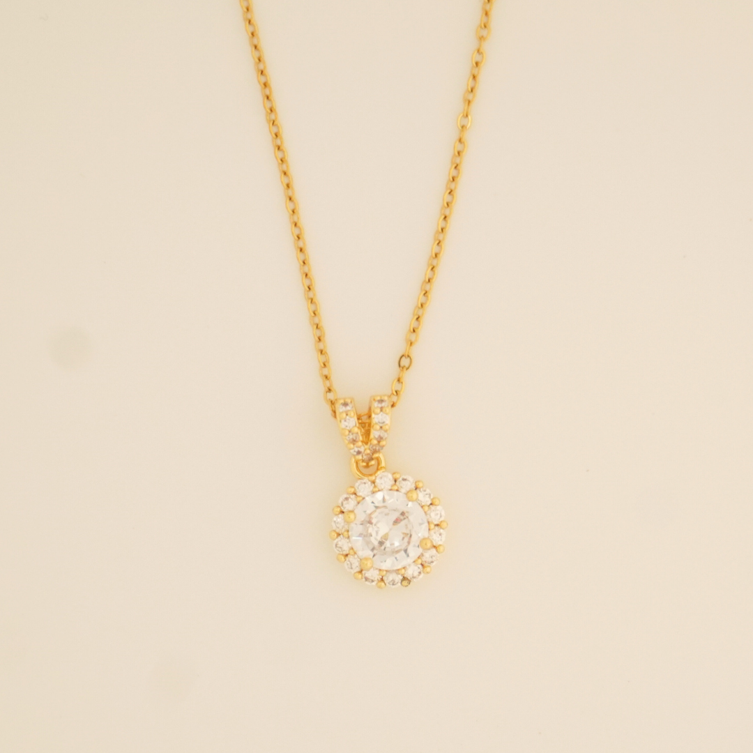 18K gold-plated round solitaire pendant necklace with halo-style cubic zirconia stones on a classic chain from Ashara Jewels.