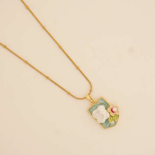 BloomScript Pendant Necklace with floral enamel charm on gold-toned beaded chain
