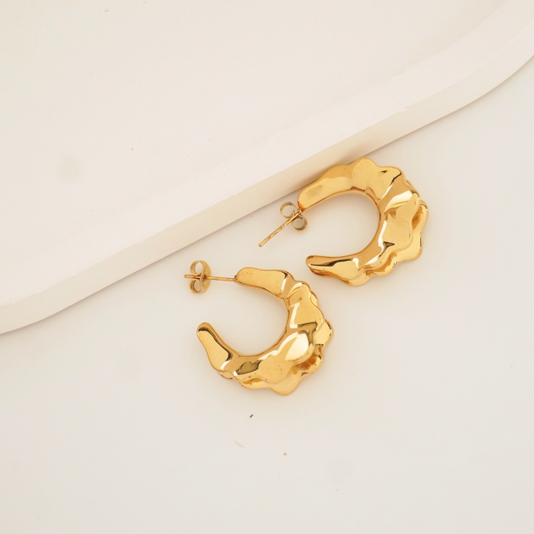 Sculptural molten gold hoop earrings with 18K gold plating – waterproof and anti-tarnish statement hoops by Ashara Jewels
