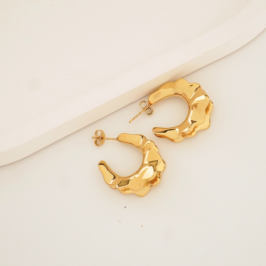 Sculptural molten gold hoop earrings with 18K gold plating – waterproof and anti-tarnish statement hoops by Ashara Jewels
