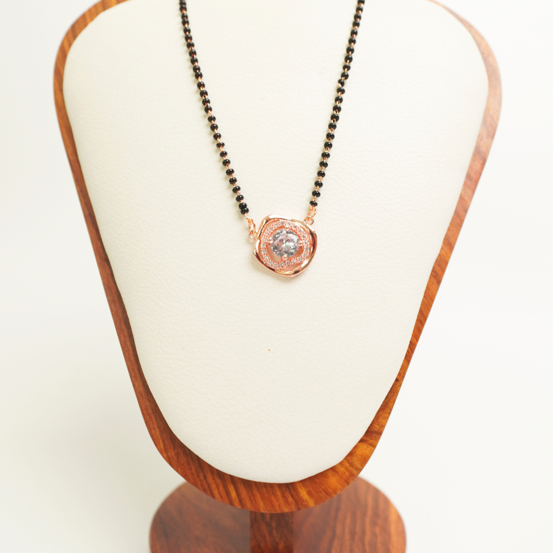 Solitaire rose gold mangalsutra with central CZ stone and black beads, anti-tarnish stainless steel
