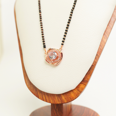 Solitaire rose gold mangalsutra with central CZ stone and black beads, anti-tarnish stainless steel
