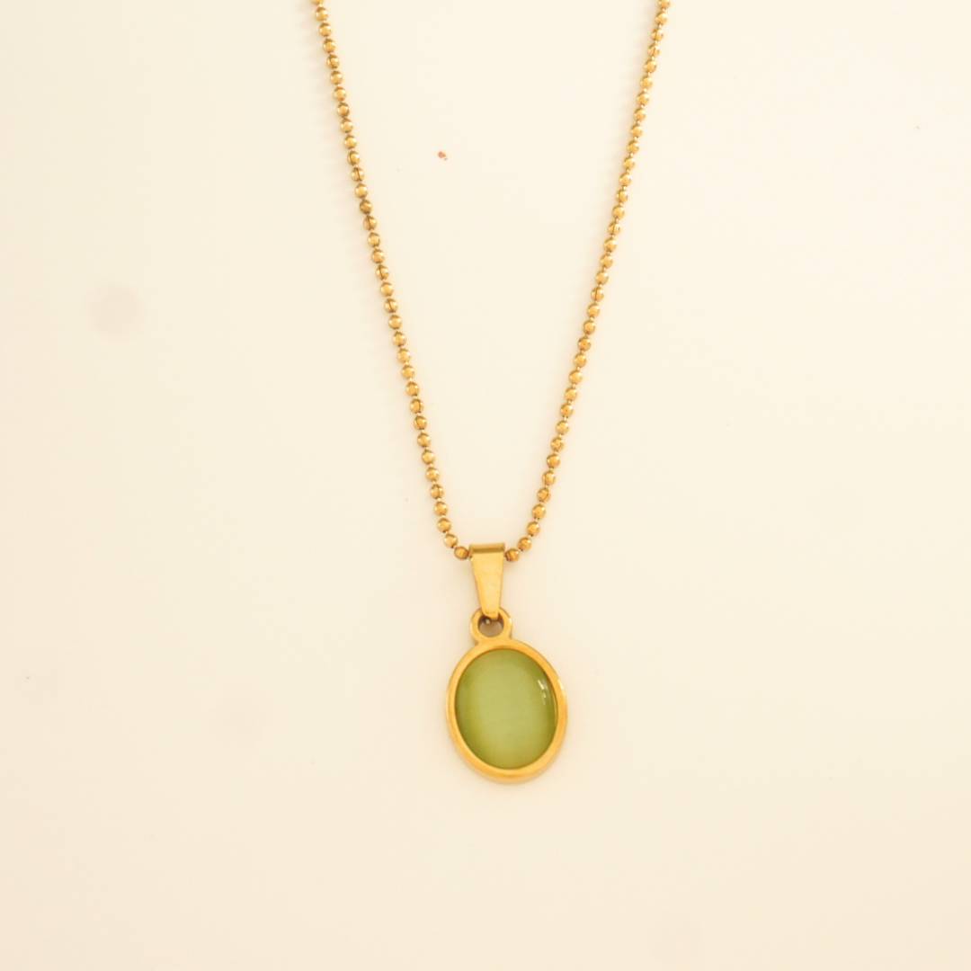 18K gold-plated oval pendant necklace with olive green enamel center on a beaded chain from Ashara Jewels’ Everyday Glam collection

