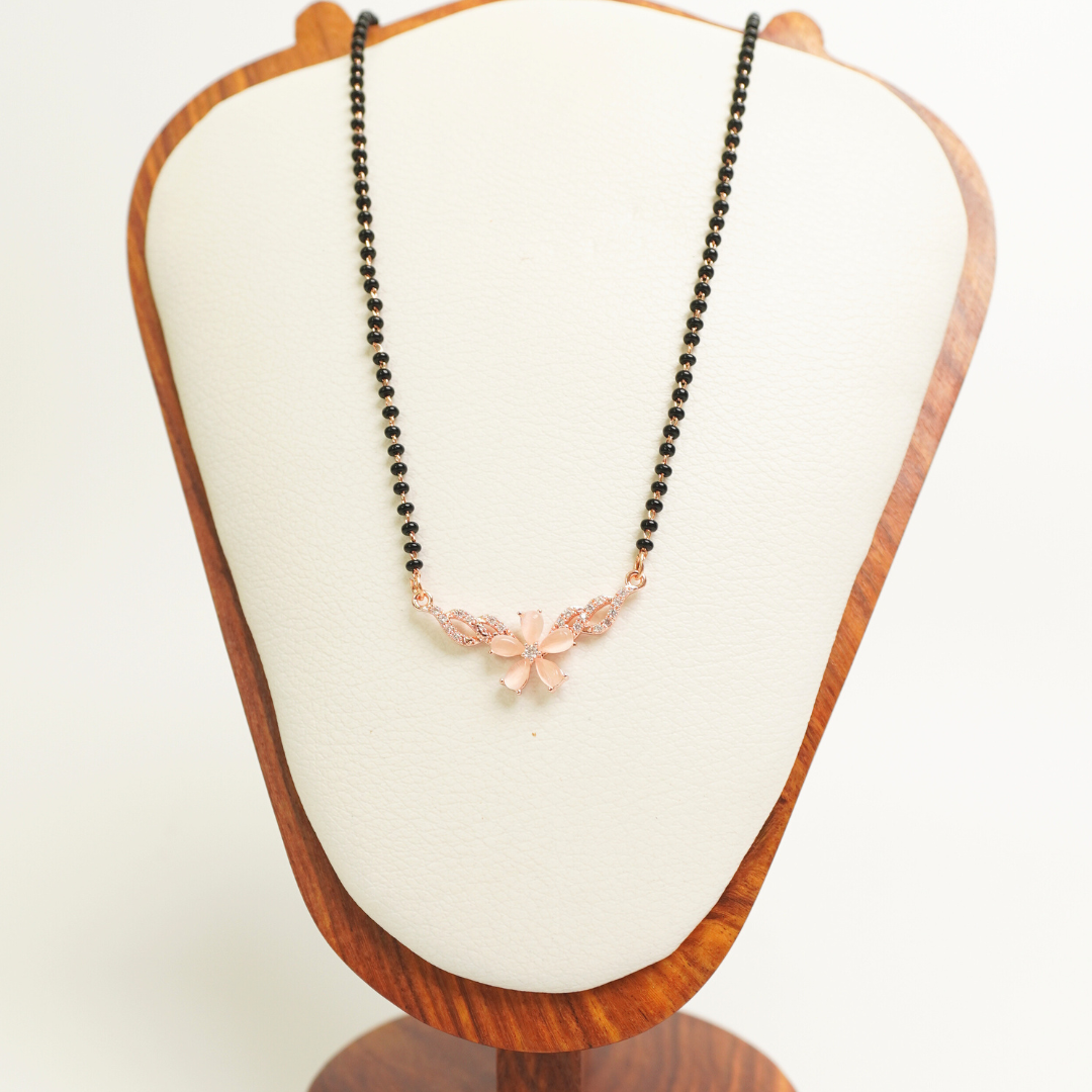 Rose gold mangalsutra with matte floral centerpiece and CZ vine design on black bead chain, anti-tarnish

