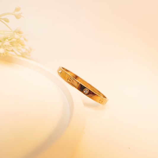 Emblem Bangle – Gold-Plated Screw Motif Designer Bracelet