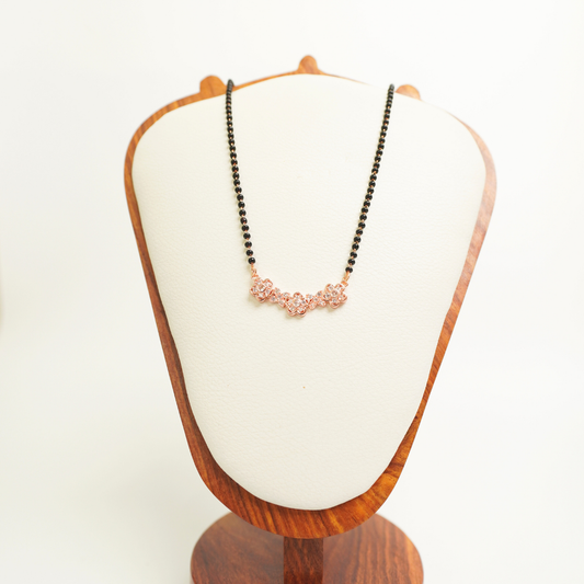 Rose gold floral mangalsutra with black beads and anti-tarnish stainless steel chain
