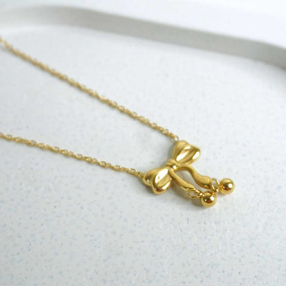 Golden Bow Pendant Necklace
