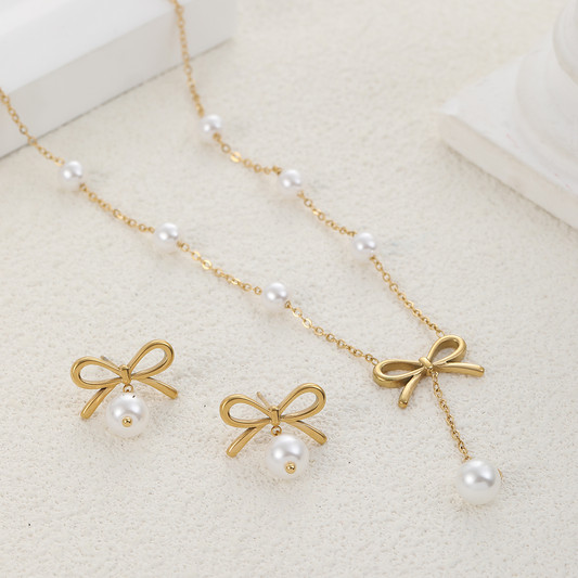Gold bow and pearl necklace with matching earrings – Ashara Jewels”
