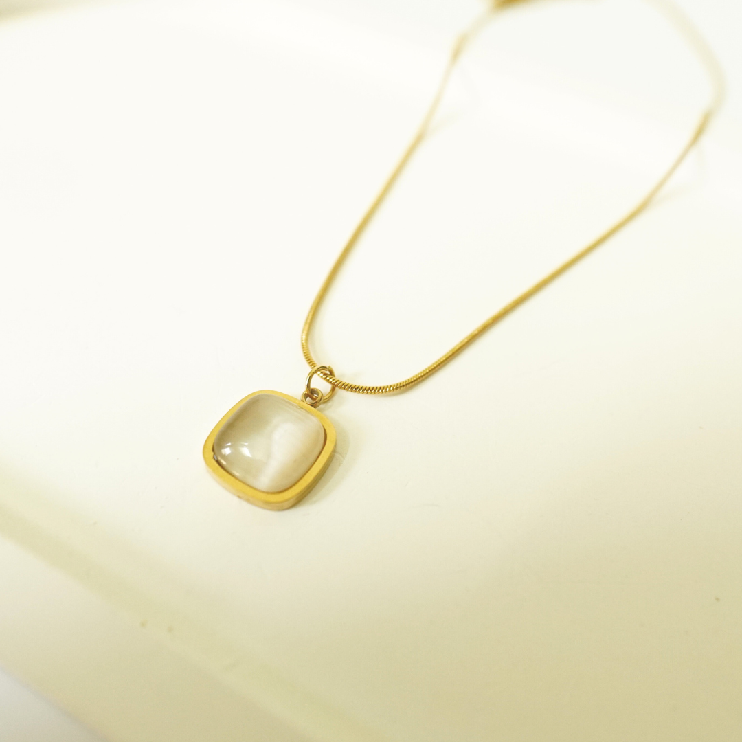 18K gold-plated necklace with a cushion-cut translucent white stone pendant, minimalist and waterproof jewelry for everyday wear.”
