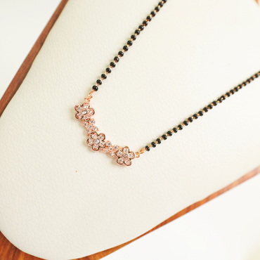Rose gold floral mangalsutra with black beads and anti-tarnish stainless steel chain
