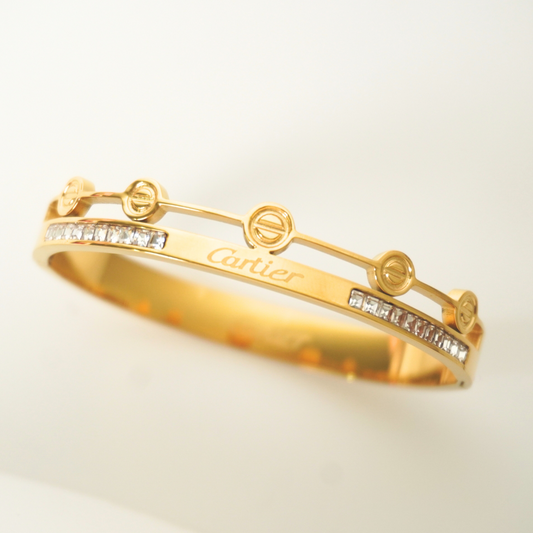 Gold Cartier-inspired dual band bracelet with illusion-cut stones and circular detailing – Ashara Jewels”