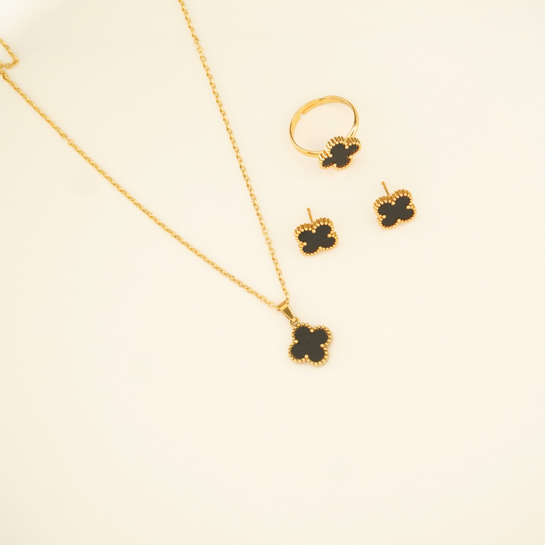 18K gold-plated black enamel clover charm necklace, earrings, and ring set from Ashara Jewels