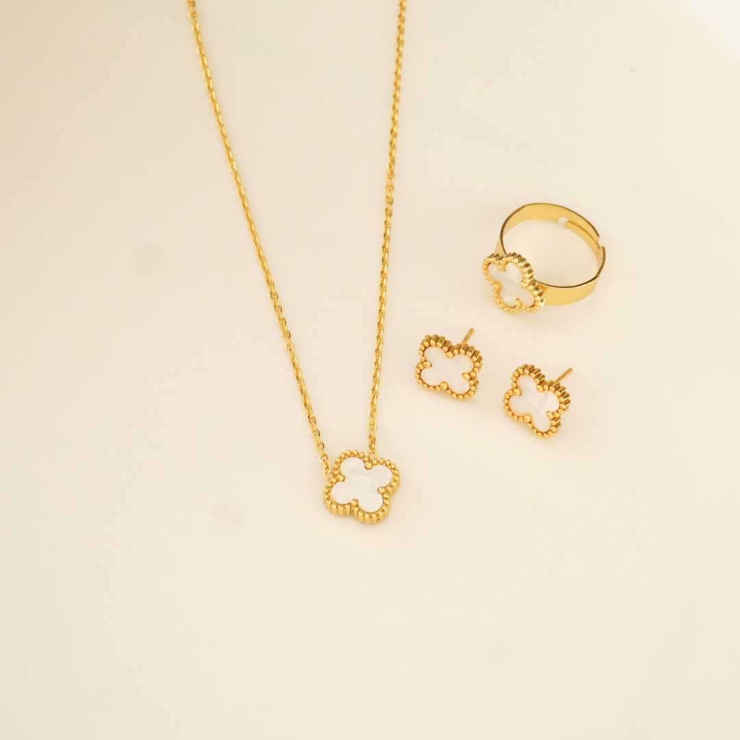 18K gold-plated white enamel clover necklace, stud earrings, and adjustable ring set from Ashara Jewels