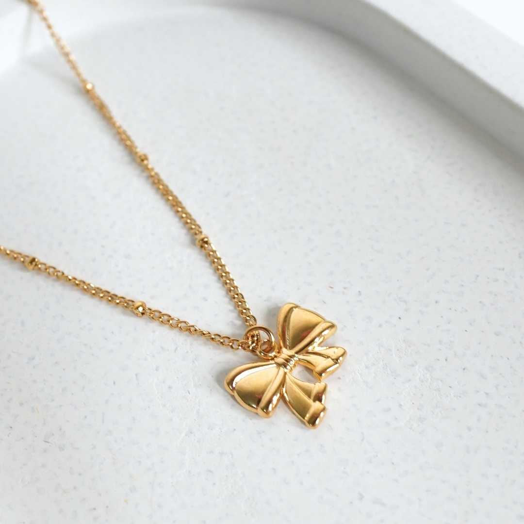Golden Flutter Bow Pendant Necklace