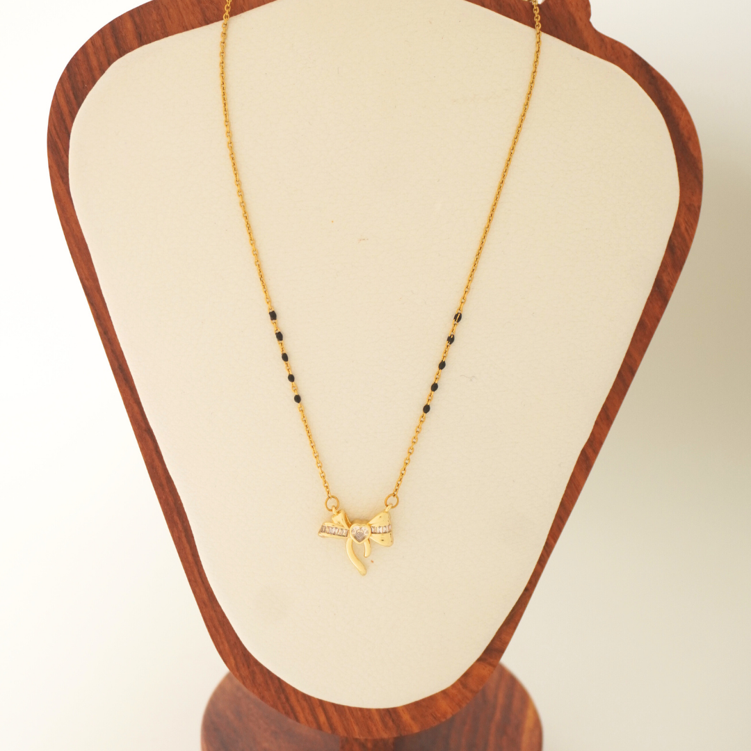 18K gold-plated bow heart mangalsutra with black beads – waterproof, anti-tarnish jewelry by Ashara Jewels