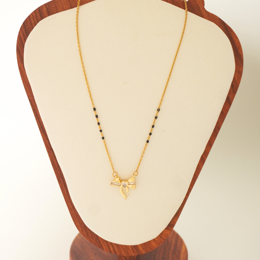 18K gold-plated bow heart mangalsutra with black beads – waterproof, anti-tarnish jewelry by Ashara Jewels